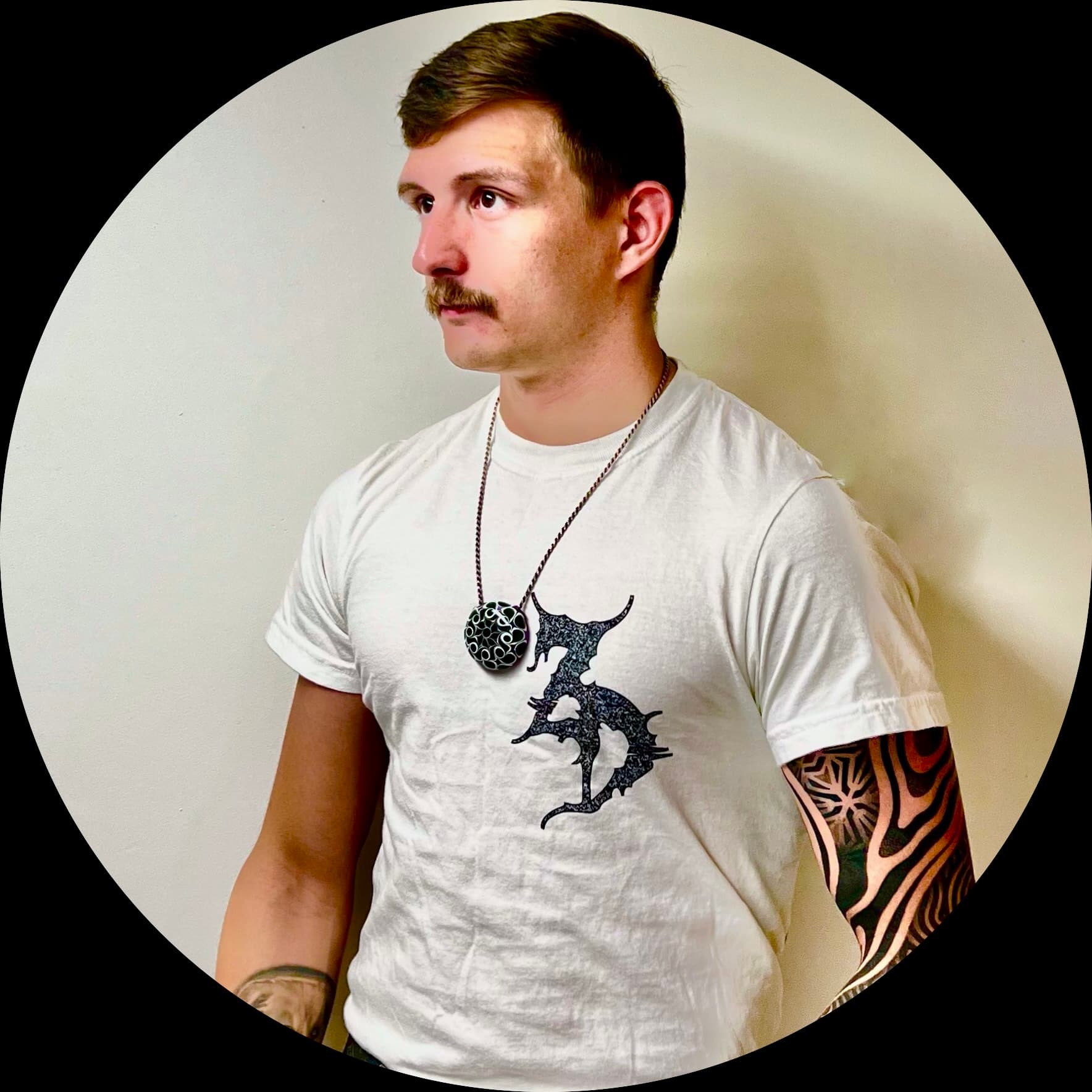 Zachary Reece, with his geometric tattoo sleeve visible